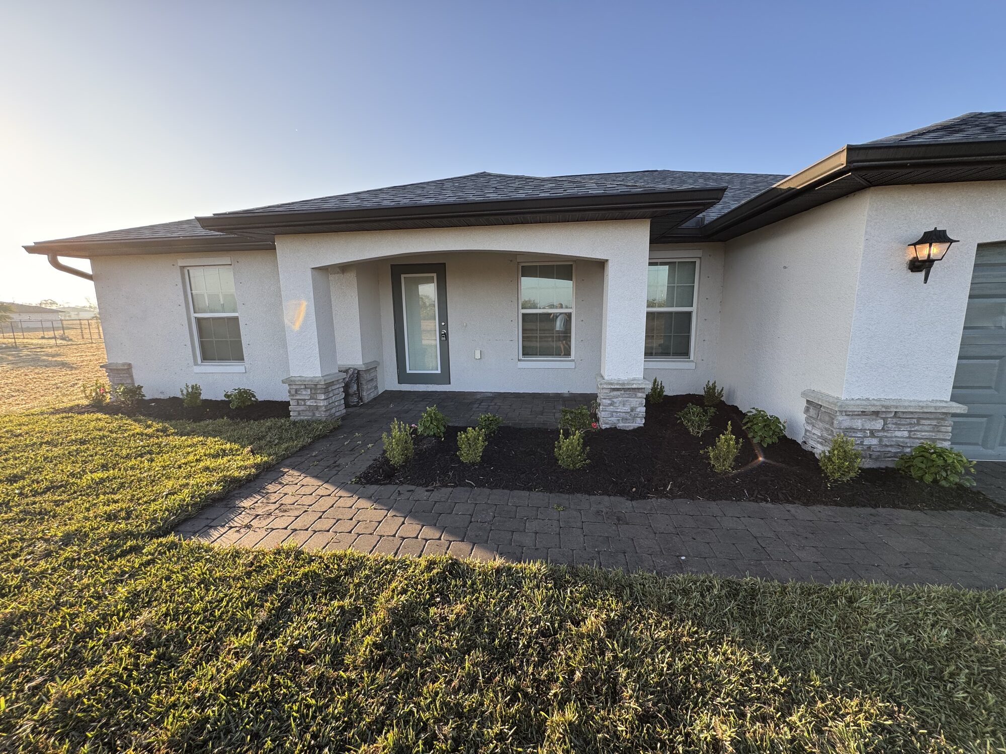 Front entry landscape bed install in Cape Coral